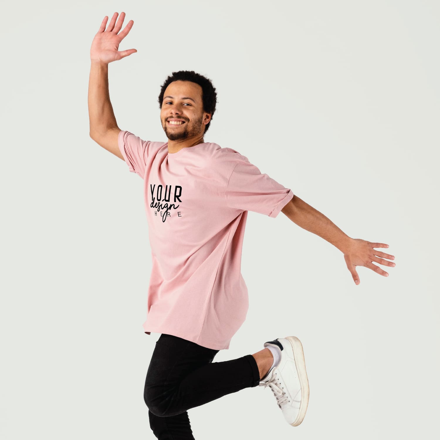 Man wearing a pink custom t-shirt with black logo design on a light gray background