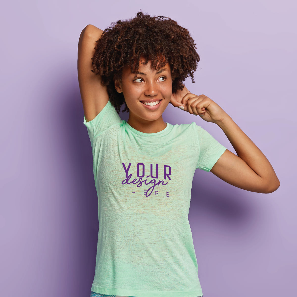 Woman wearing a mint green custom t-shirt with logo design on a purple background