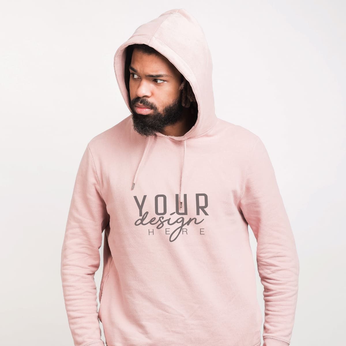 Man wearing a light pink custom hoodie with logo design on a white background