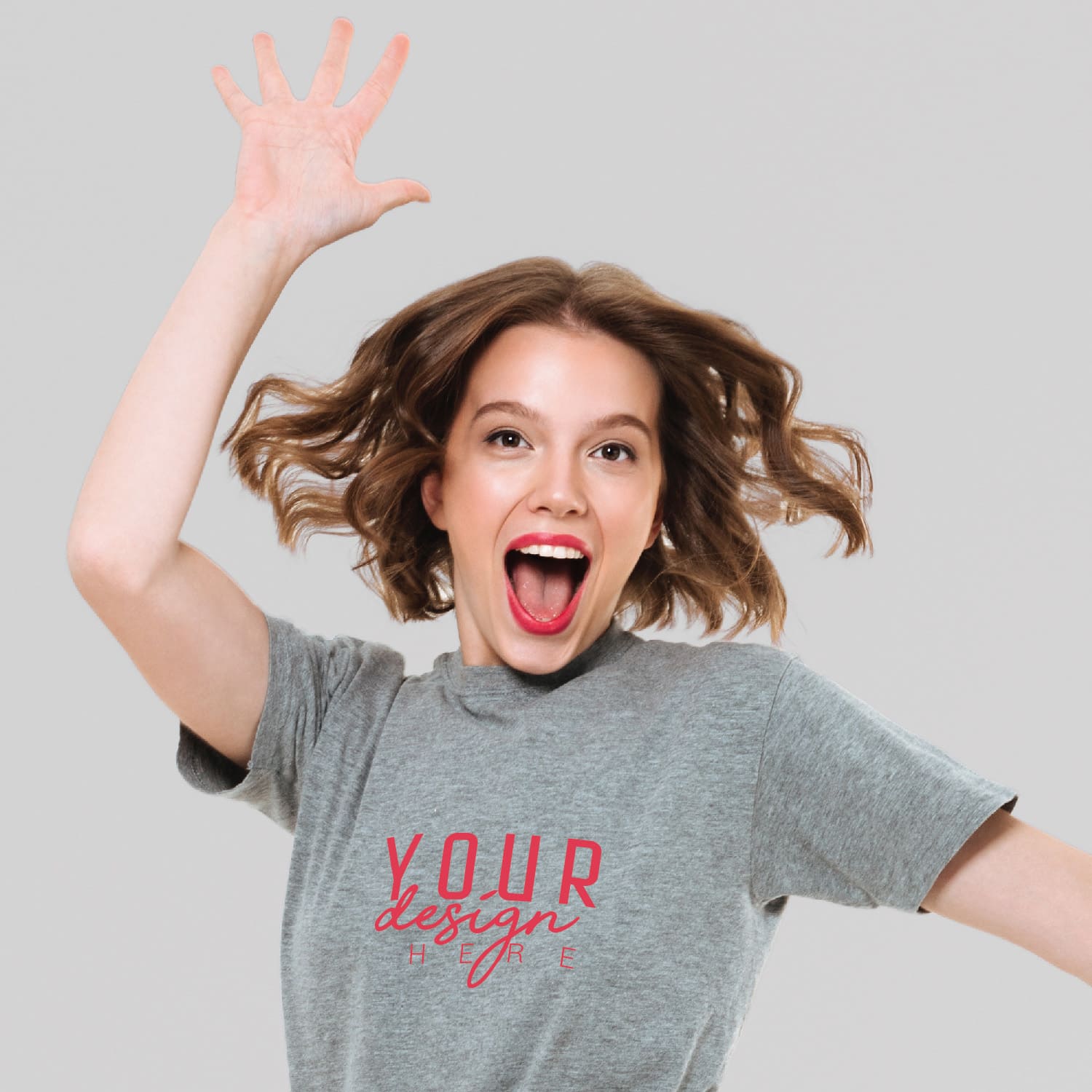 Woman wearing a gray custom t-shirt with pink logo design on a light gray background